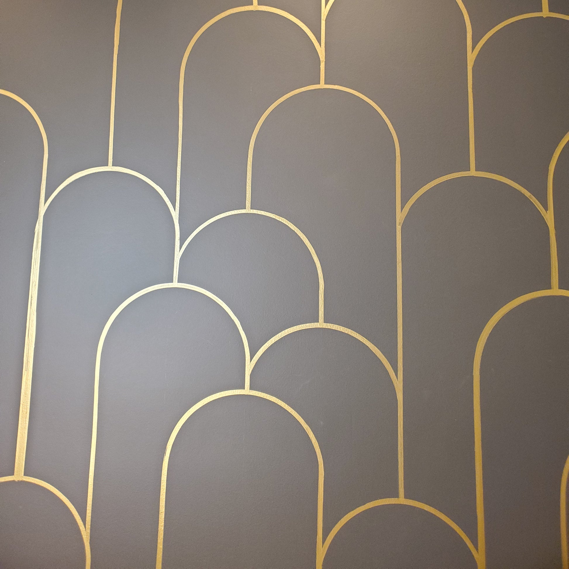 thin gold art deco arches black wall