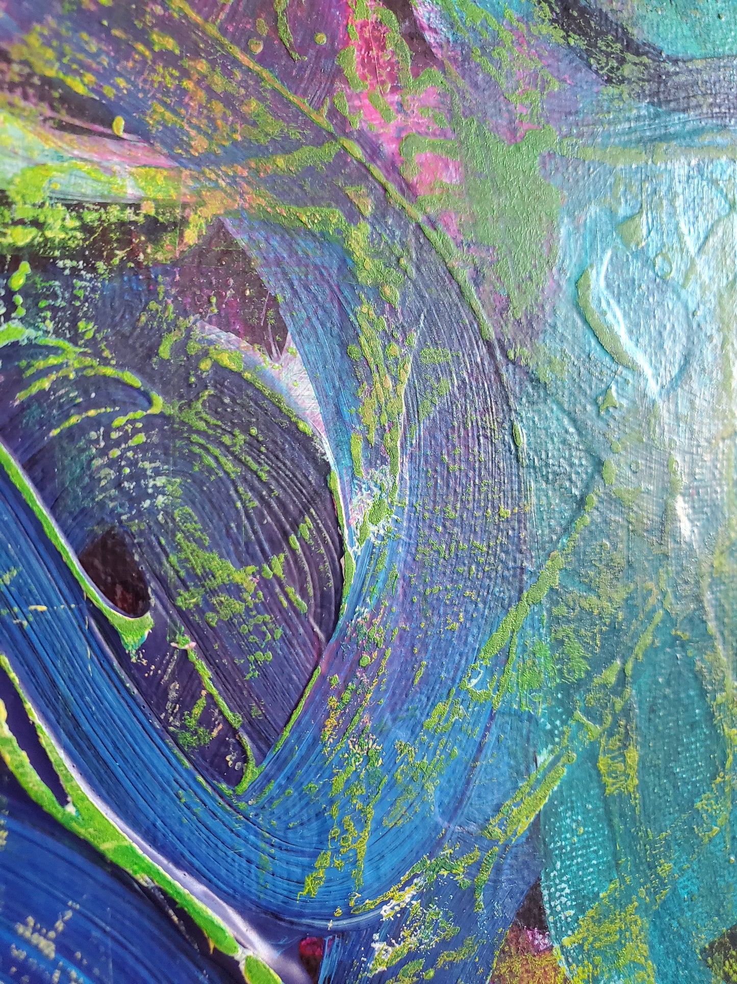 Abstract art with a mix of blue, green, and purple colors.